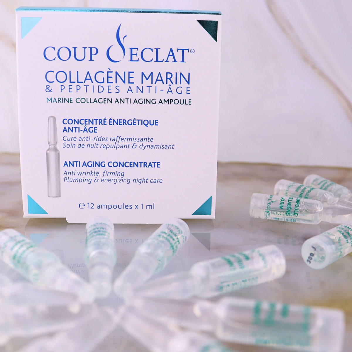 Boîte et ampoules du Concentré Énergétique au Collagène Marin Coup d'Eclat
